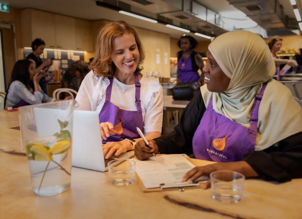 A team cooking together at a class, one of the employee appreciation ideas