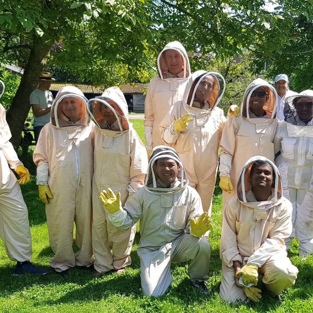 Team members beekeeping in London