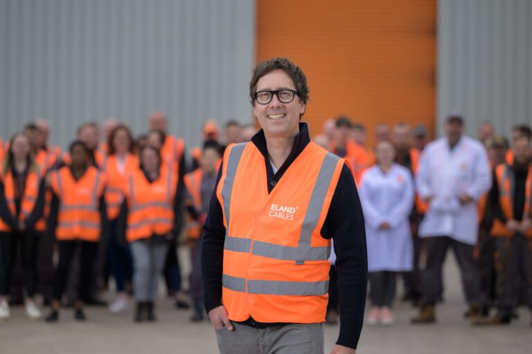 JS Pelland, Executive Director at Eland Cables, with warehouse staff, in a Real Living Wage staff retention story
